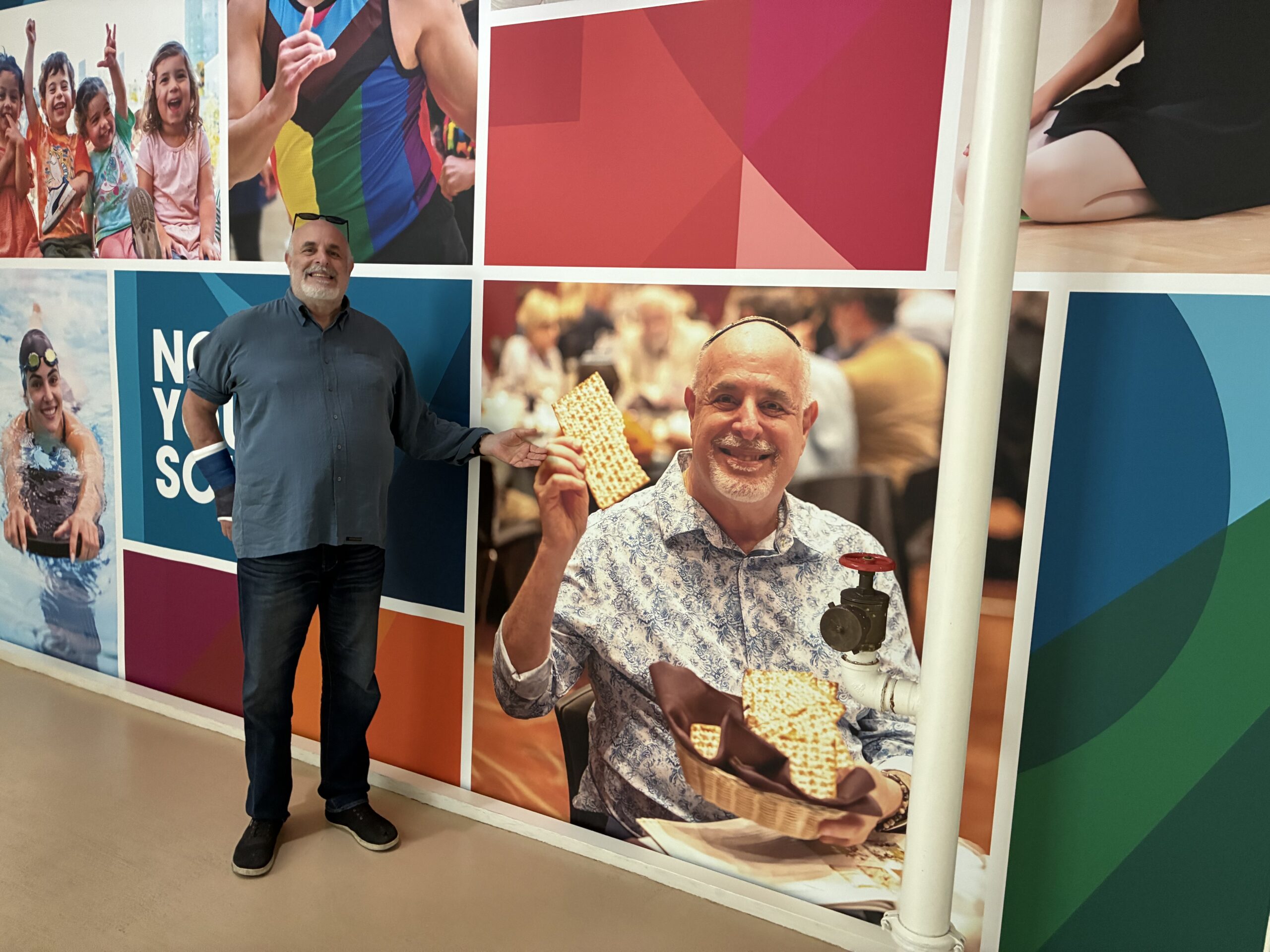 Ramni infront of a poster